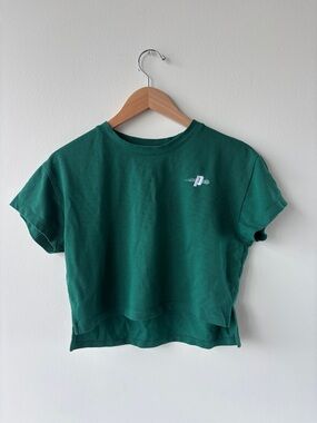green cropped tee with small prince pickleball logo, size small